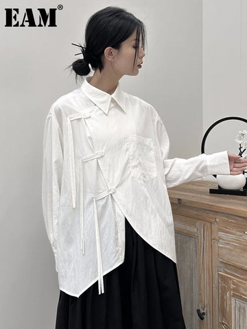 [EAM] Women White Buckle Irregular Big Size Blouse New Lapel Long Sleeve Loose Fit Shirt Fashion Tide Spring Autumn 2026 1DF7846